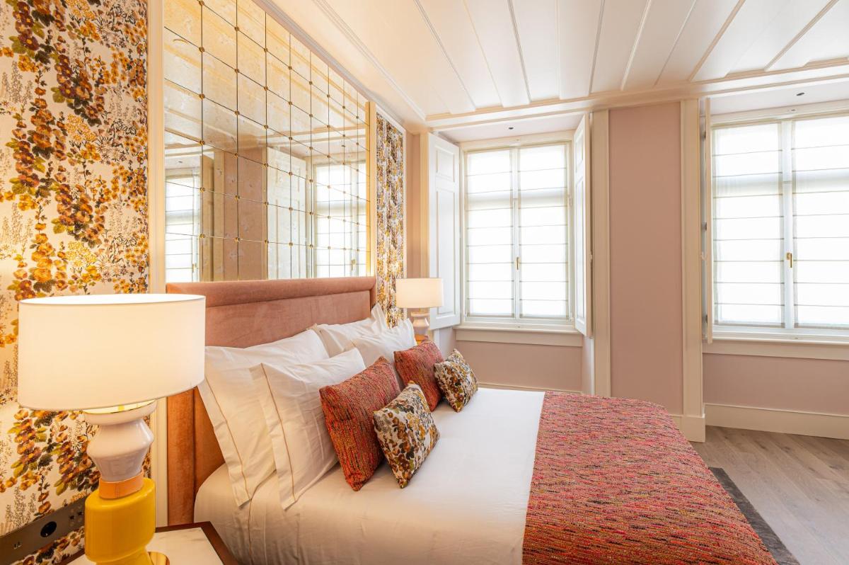 Uma cama ou camas num quarto em Palácio Ludovice Wine Experience Hotel