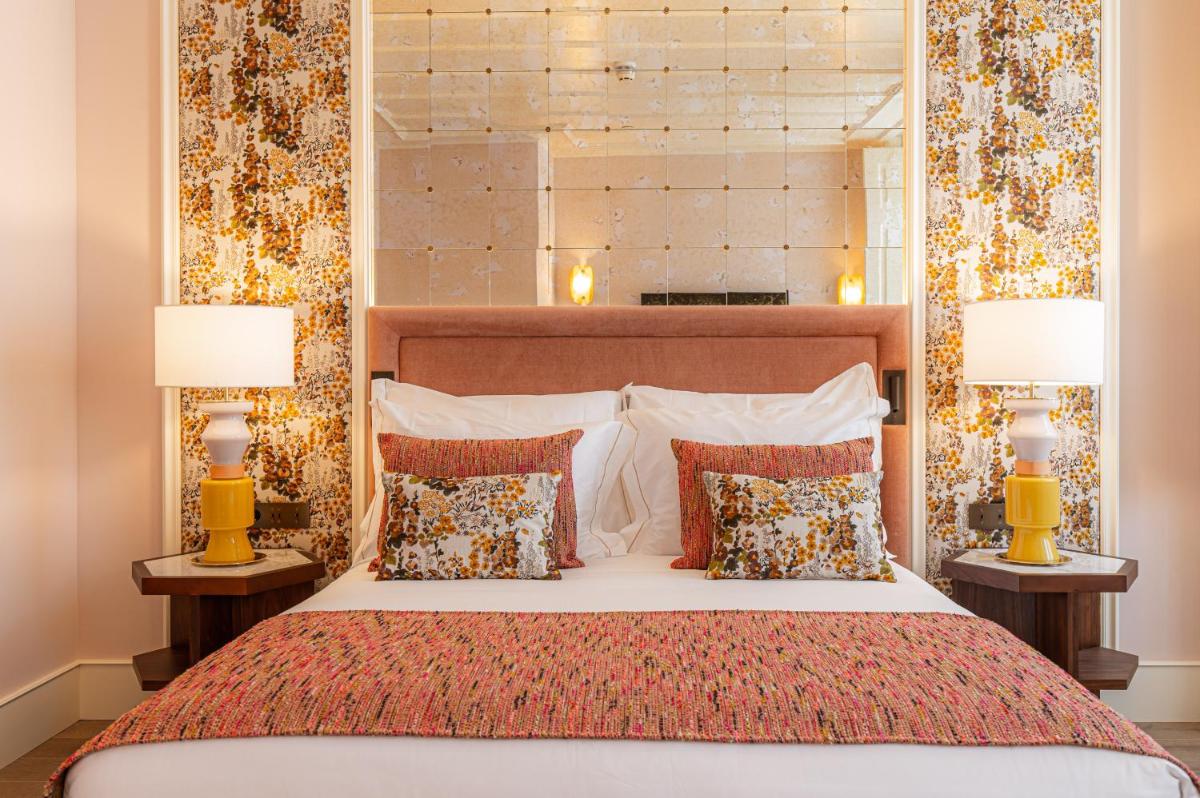 Uma cama ou camas num quarto em Palácio Ludovice Wine Experience Hotel
