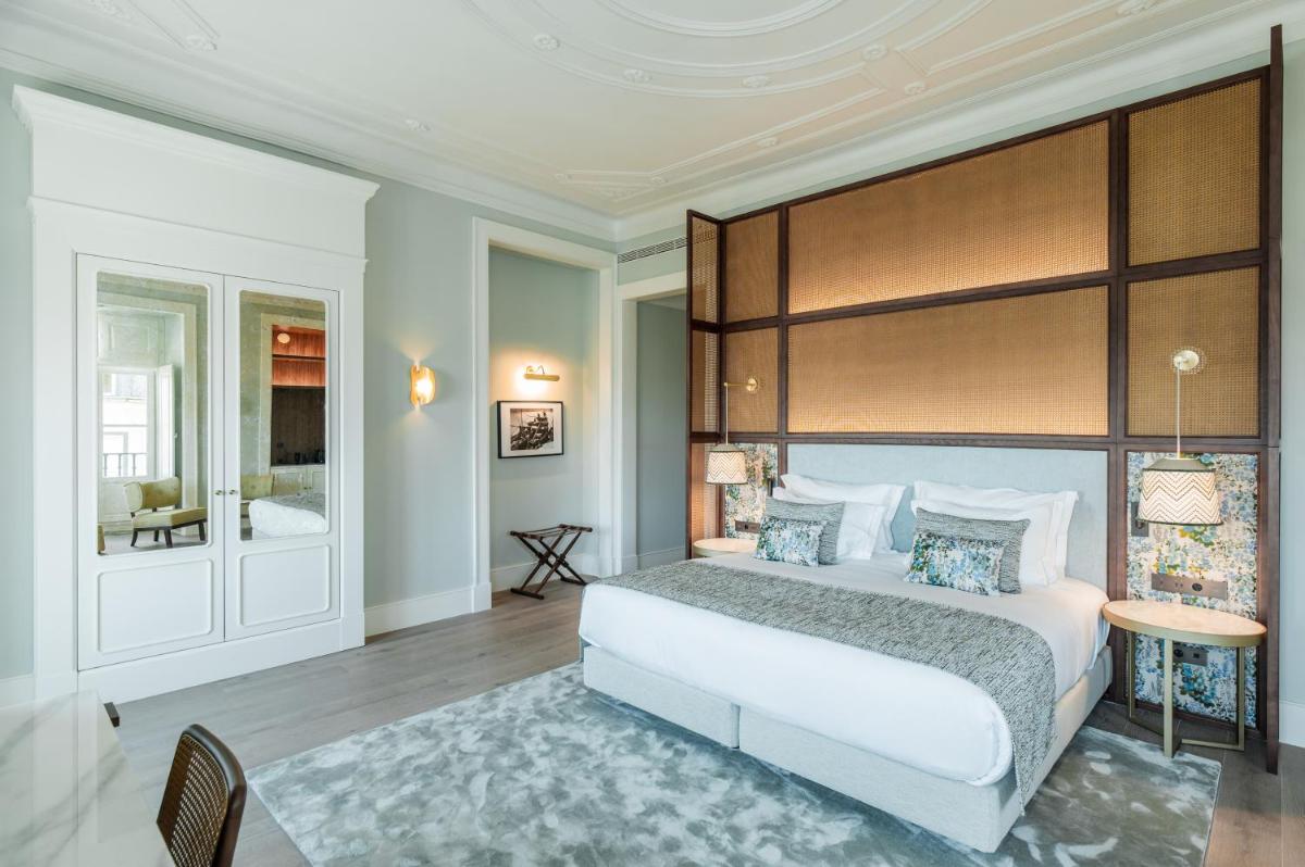 Uma cama ou camas num quarto em Palácio Ludovice Wine Experience Hotel