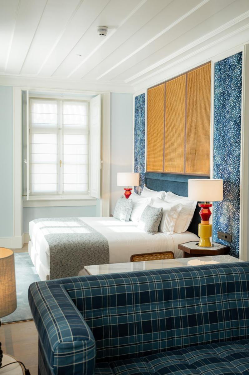 Uma cama ou camas num quarto em Palácio Ludovice Wine Experience Hotel