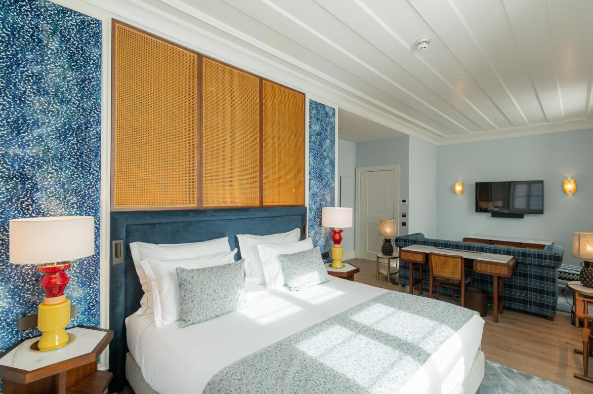Uma cama ou camas num quarto em Palácio Ludovice Wine Experience Hotel