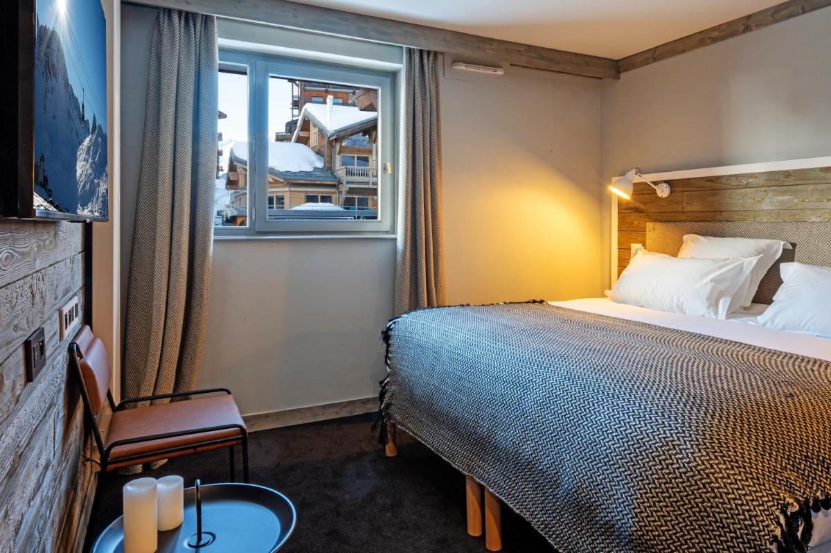 Un ou plusieurs lits dans un hébergement de l'établissement Hôtel Le Levanna by Les Etincelles