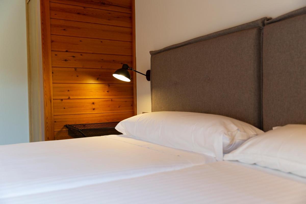 Cama o camas de una habitación en IBERIK Augas Santas Balneario & Golf