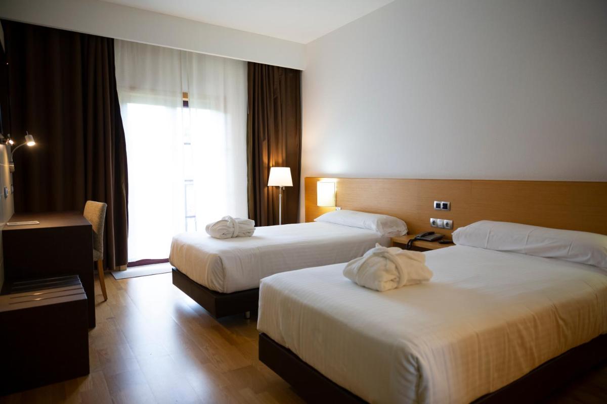 Cama o camas de una habitación en IBERIK Augas Santas Balneario & Golf