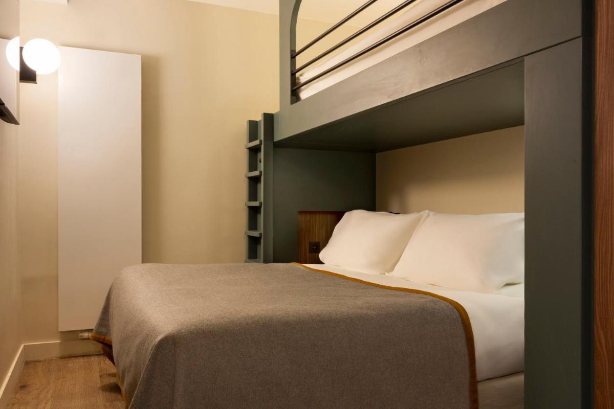 Un ou plusieurs lits dans un hébergement de l'établissement RockyPop Flaine Hotel & Spa