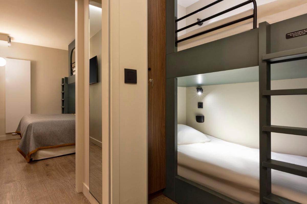 Un ou plusieurs lits dans un hébergement de l'établissement RockyPop Flaine Hotel & Spa