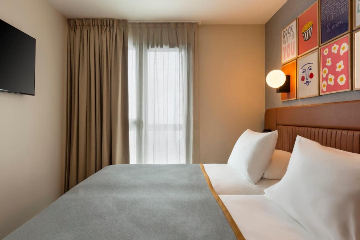 Un ou plusieurs lits dans un hébergement de l'établissement RockyPop Flaine Hotel & Spa