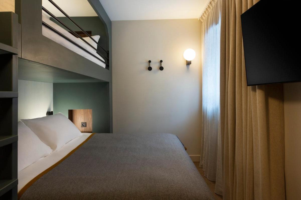 Un ou plusieurs lits dans un hébergement de l'établissement RockyPop Flaine Hotel & Spa
