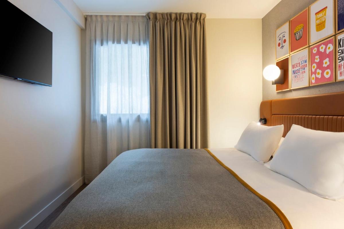 Un ou plusieurs lits dans un hébergement de l'établissement RockyPop Flaine Hotel & Spa