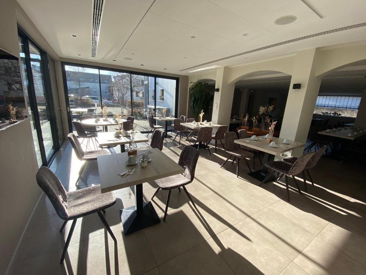 Coin salon dans l'établissement Logis Hôtel Restaurant Au Lion Rouge