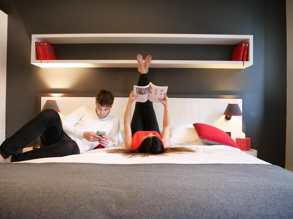 Un ou plusieurs lits dans un hébergement de l'établissement Le Faucigny - Hotel de Charme & SPA