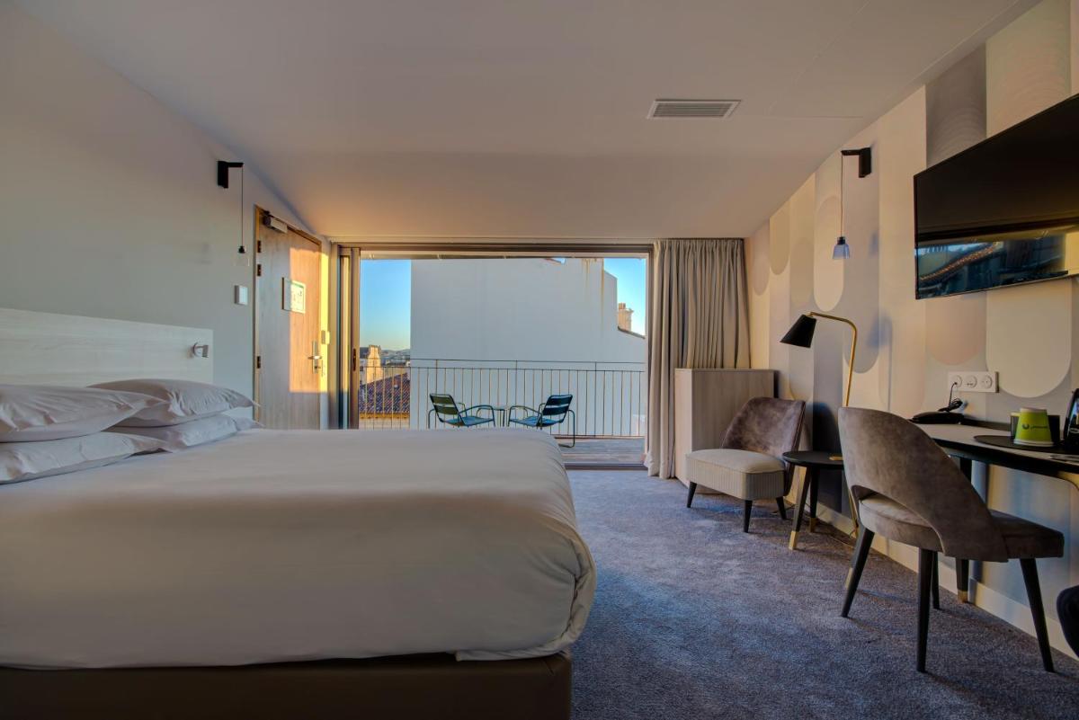Un ou plusieurs lits dans un hébergement de l'établissement Alex Hotel & Spa