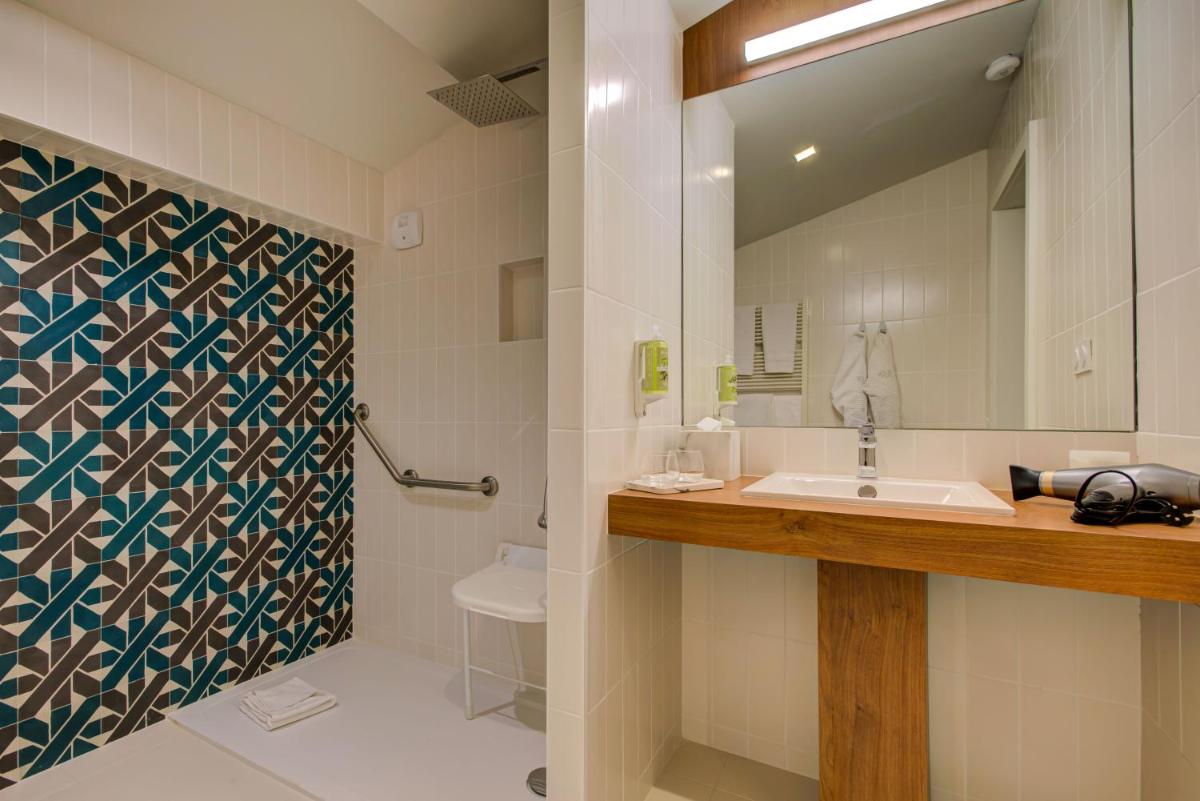 Salle de bains dans l'établissement Alex Hotel & Spa