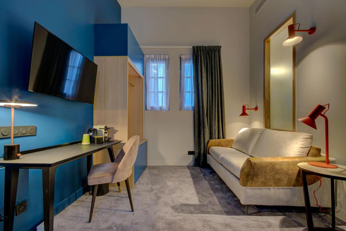 Télévision ou salle de divertissement dans l'établissement Alex Hotel & Spa