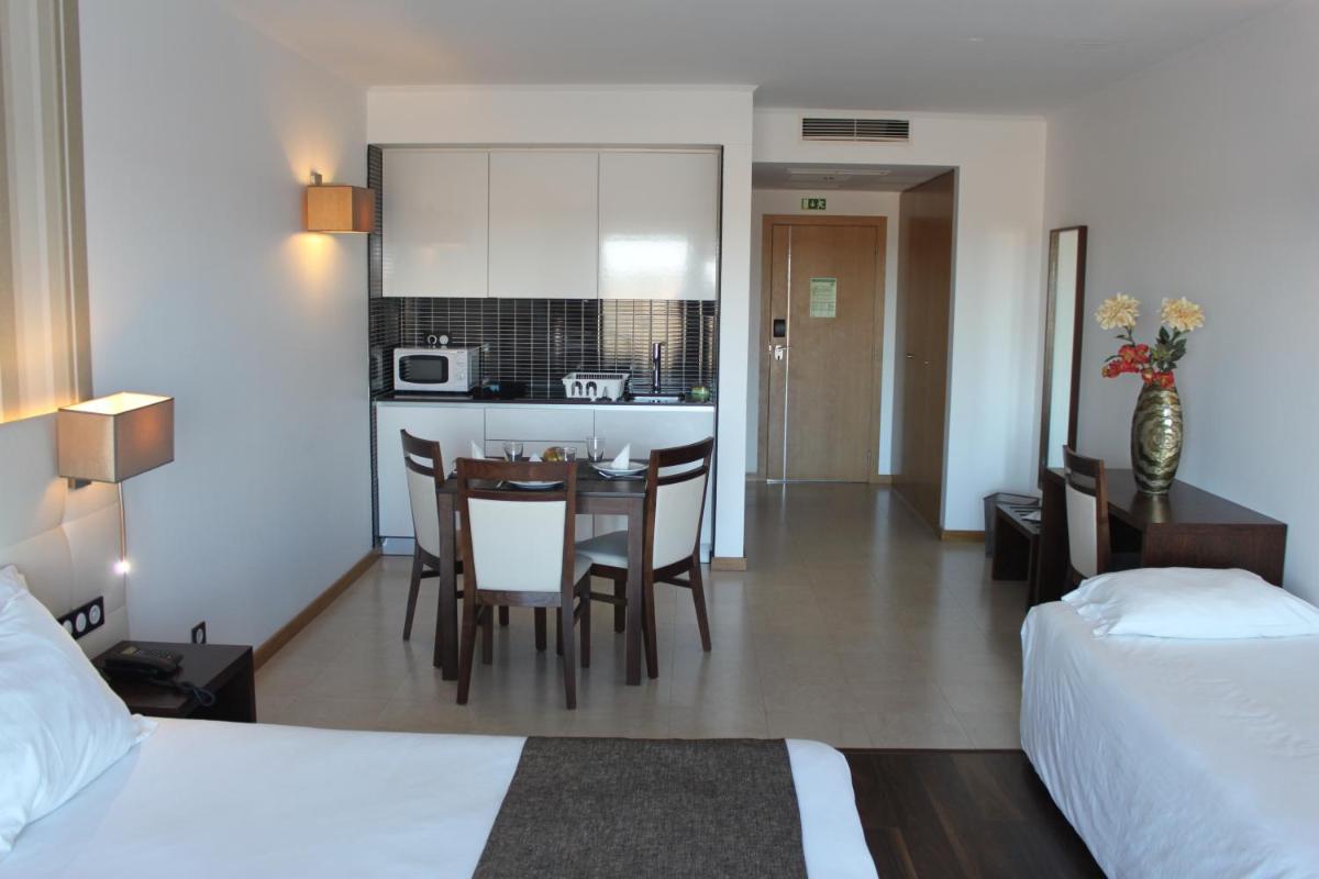 Uma cama ou camas num quarto em Hotel O Gato & Spa