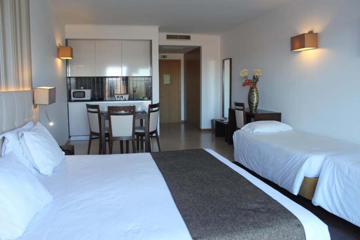 Uma cama ou camas num quarto em Hotel O Gato & Spa