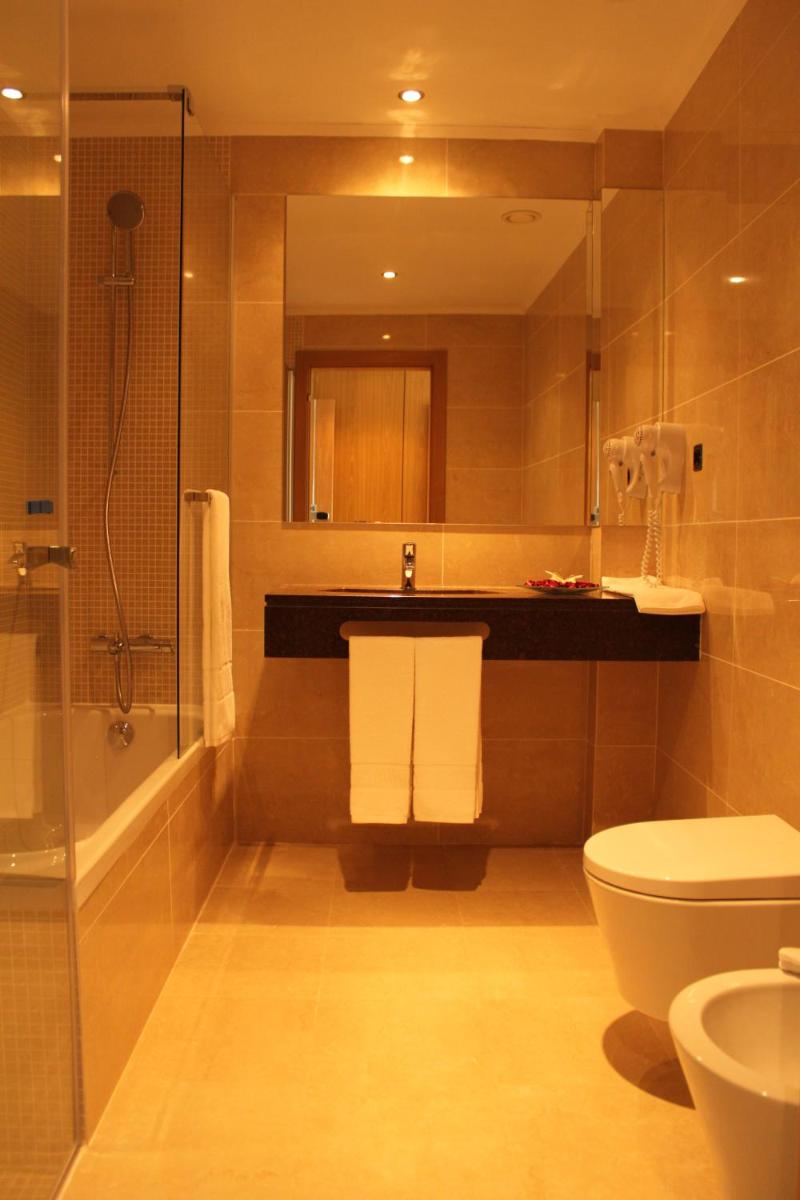 Uma casa de banho em Hotel O Gato & Spa