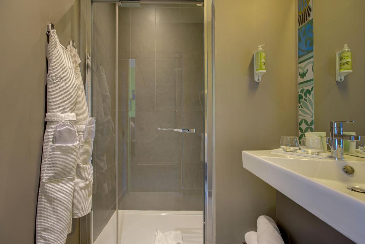 Salle de bains dans l'établissement Alex Hotel & Spa