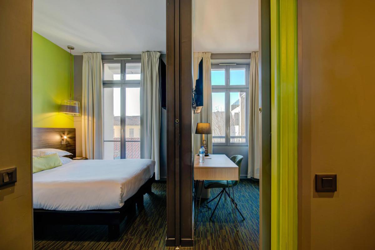 Un ou plusieurs lits dans un hébergement de l'établissement Alex Hotel & Spa