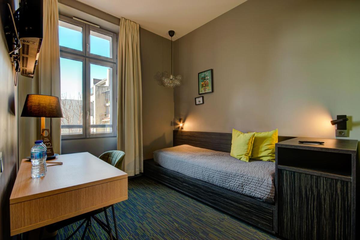 Un ou plusieurs lits dans un hébergement de l'établissement Alex Hotel & Spa