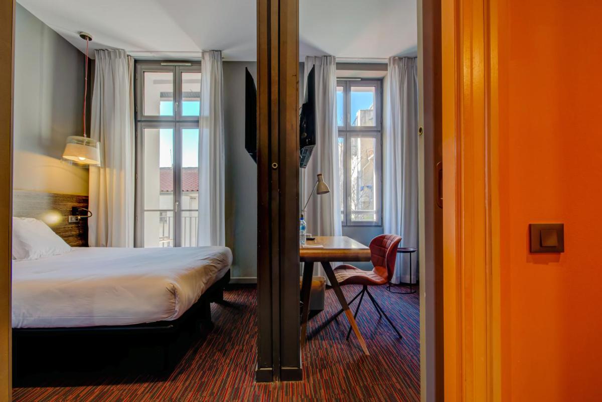 Un ou plusieurs lits dans un hébergement de l'établissement Alex Hotel & Spa