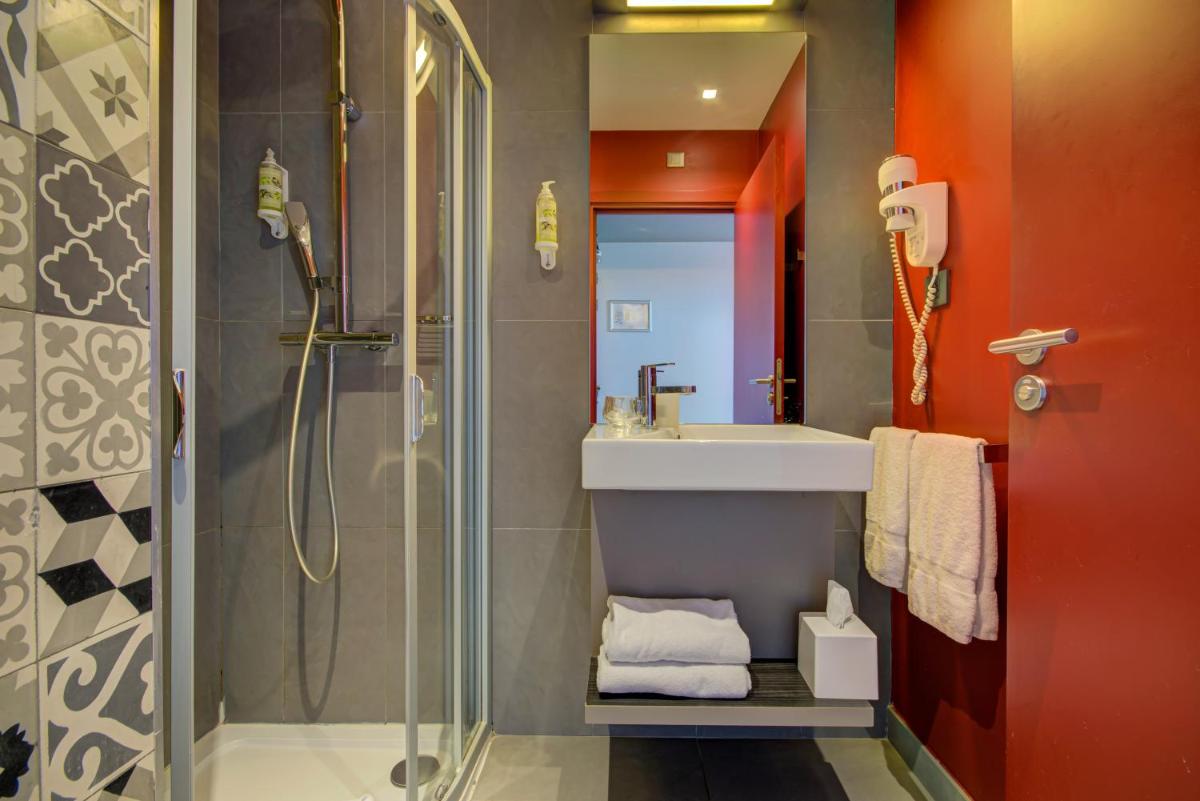 Salle de bains dans l'établissement Alex Hotel & Spa