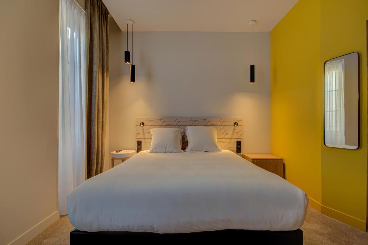 Un ou plusieurs lits dans un hébergement de l'établissement Alex Hotel & Spa