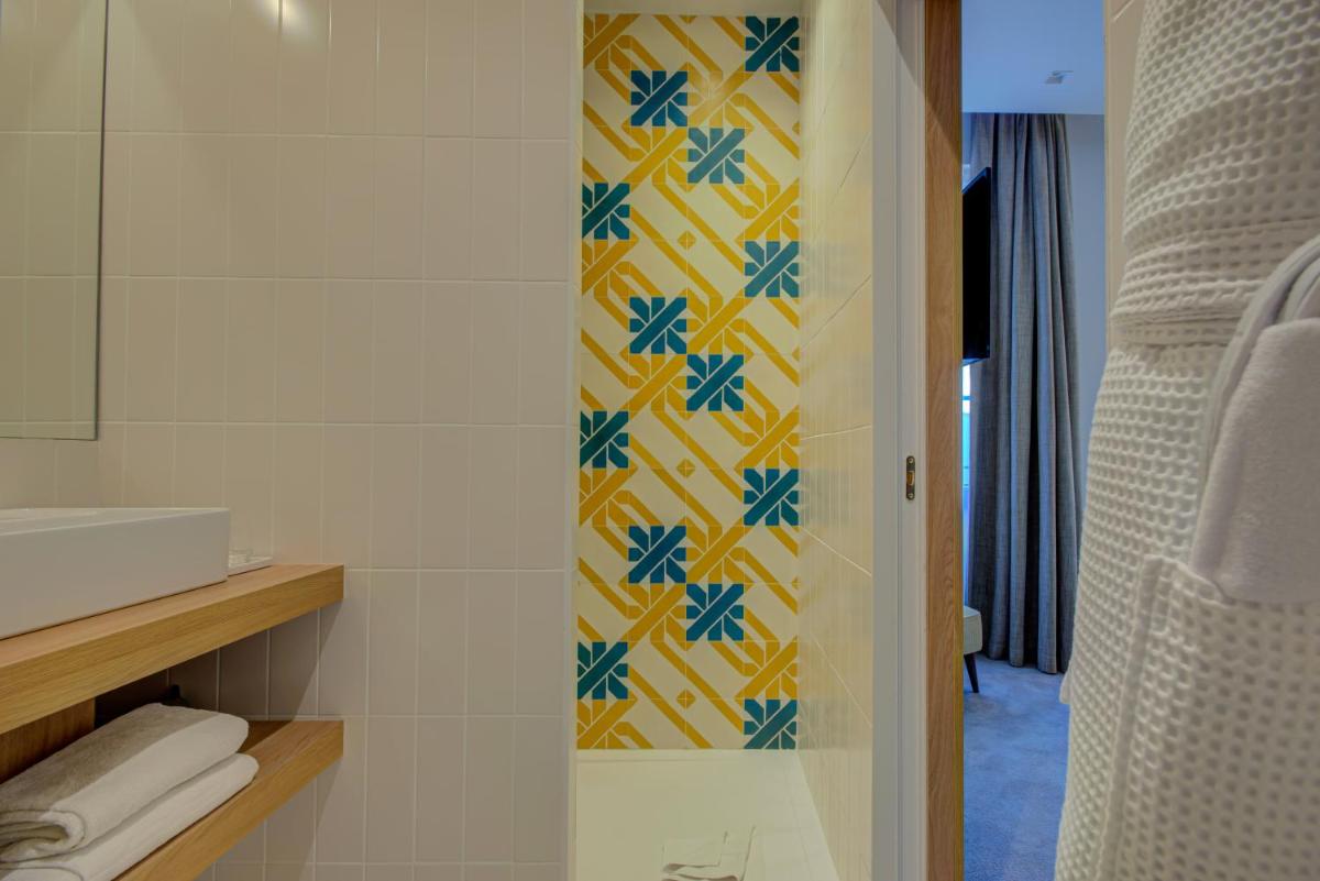 Salle de bains dans l'établissement Alex Hotel & Spa