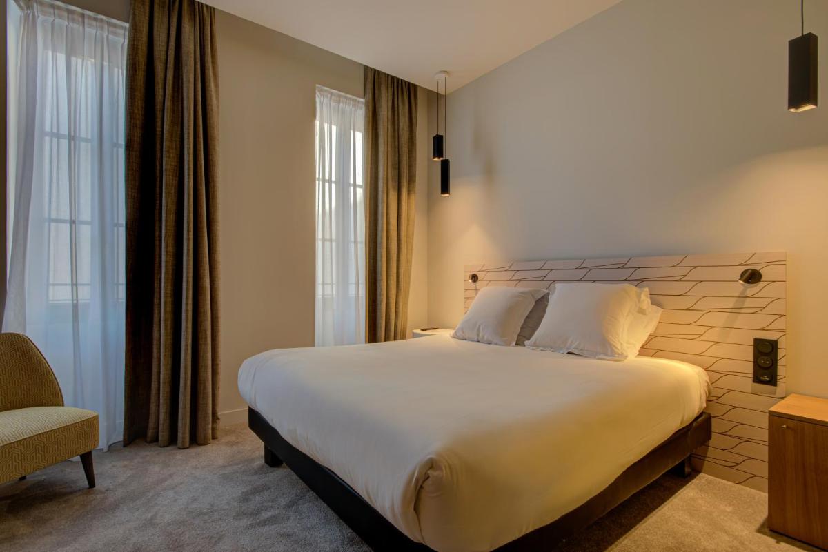 Un ou plusieurs lits dans un hébergement de l'établissement Alex Hotel & Spa