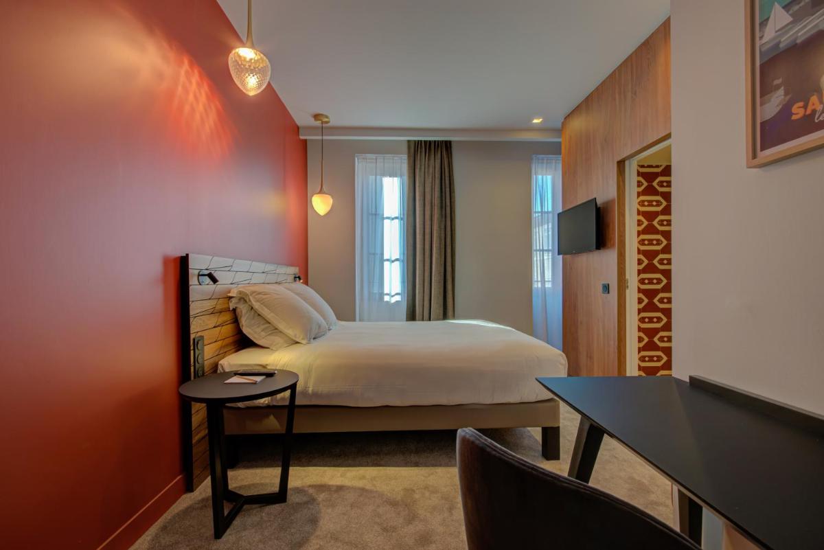 Un ou plusieurs lits dans un hébergement de l'établissement Alex Hotel & Spa