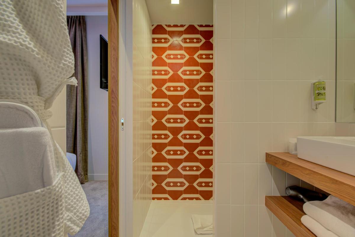 Salle de bains dans l'établissement Alex Hotel & Spa
