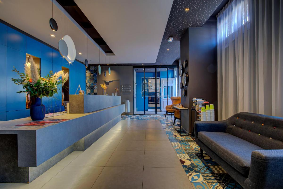 Coin salon dans l'établissement Alex Hotel & Spa