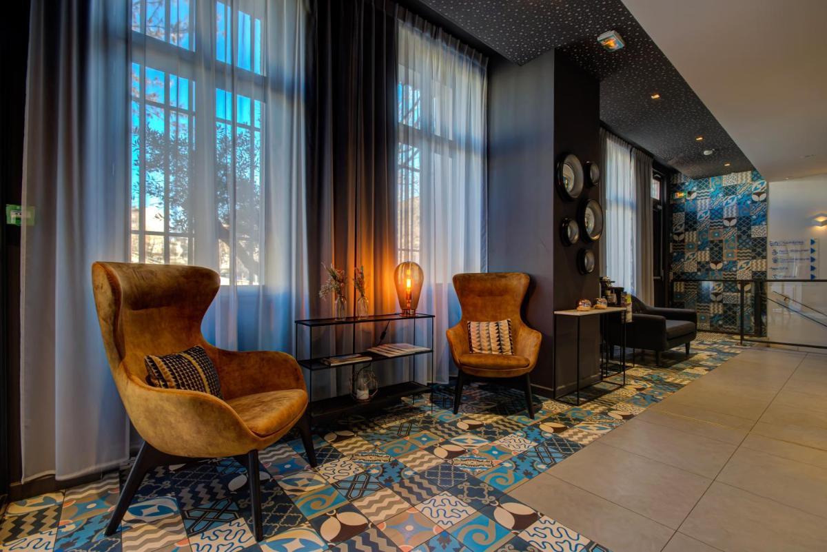 Coin salon dans l'établissement Alex Hotel & Spa