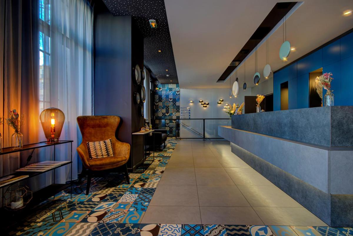 Coin salon dans l'établissement Alex Hotel & Spa