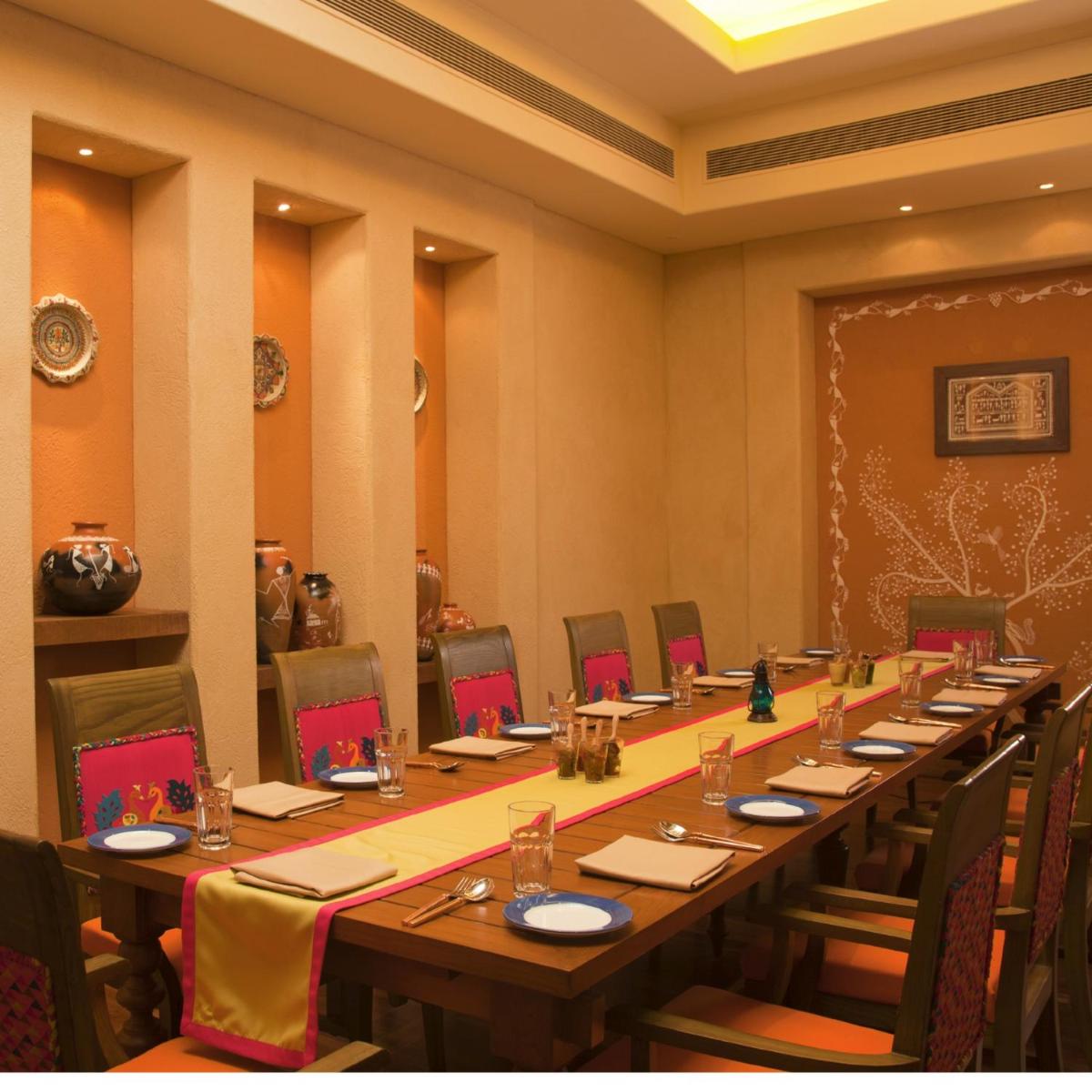 a large conference room with a long table and chairs at Radisson Blu Hotel, Nagpur in Nagpur