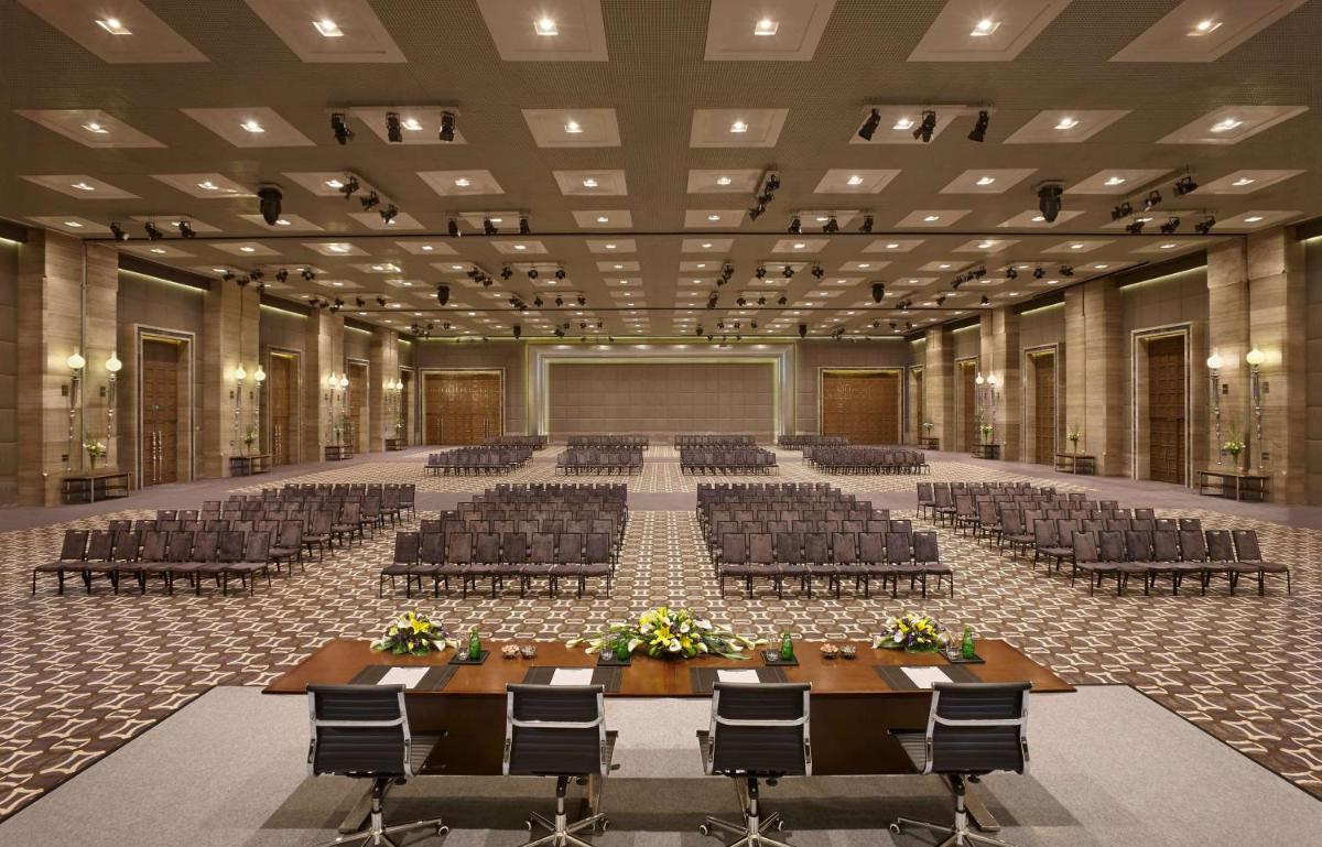 an empty conference hall with chairs and tables in it at Hyatt Regency Gurgaon in Gurgaon +38 photos
