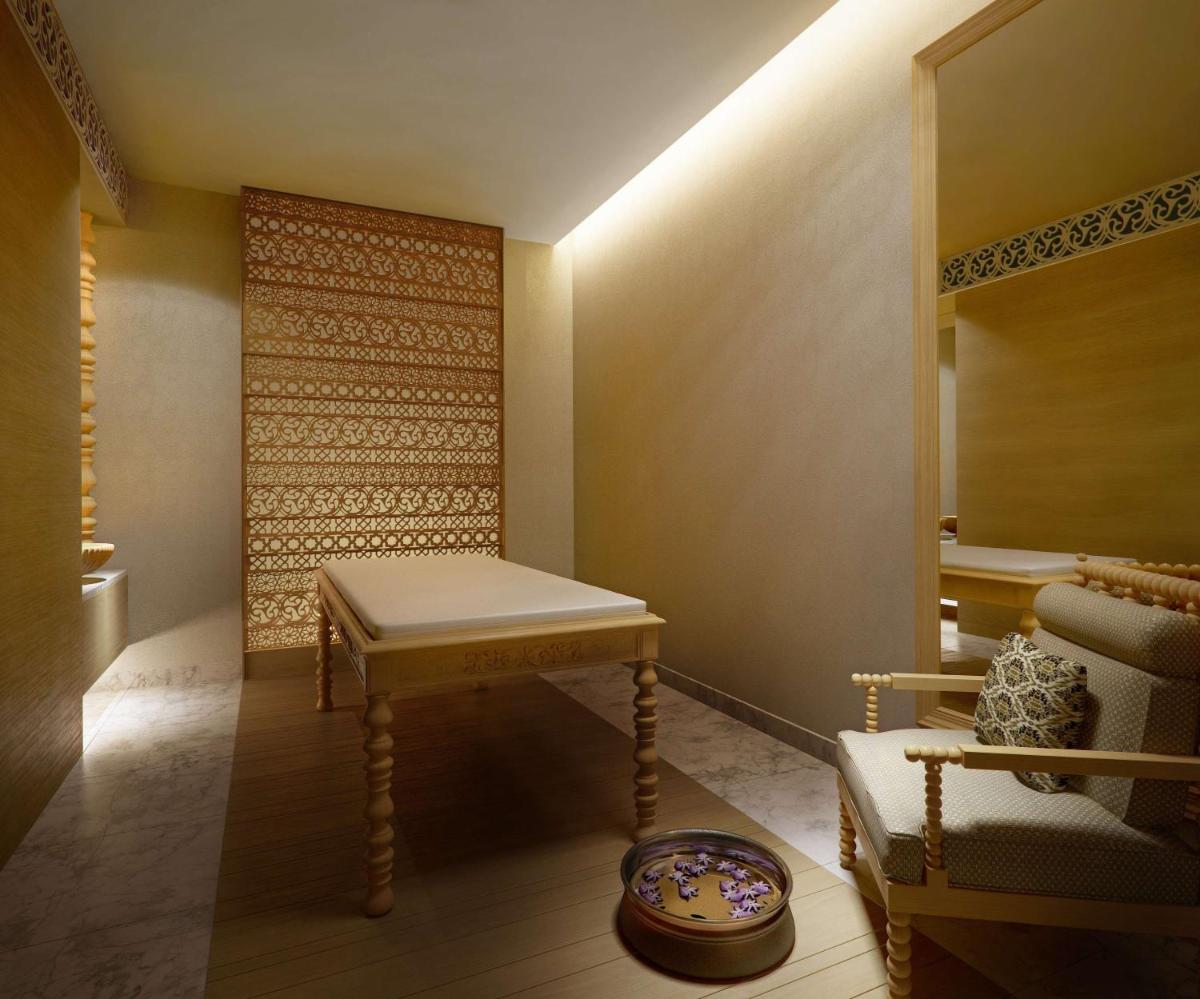 a dressing room with a table and a mirror at Hyatt Regency Gurgaon in Gurgaon