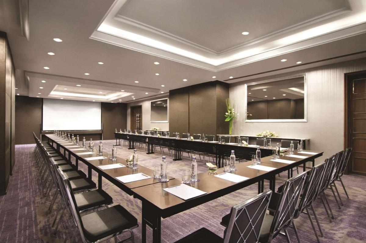 a large conference room with a long table and chairs at Hyatt Regency Gurgaon in Gurgaon
