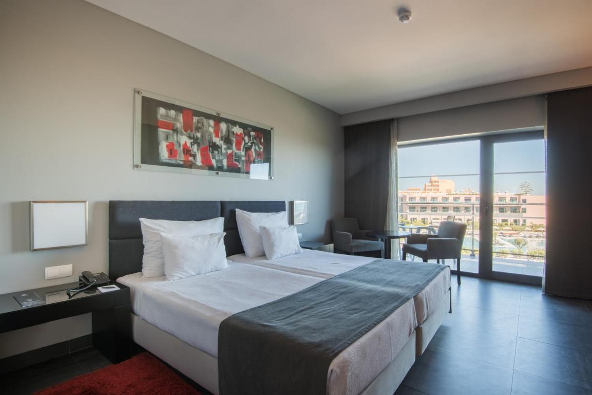 Uma cama ou camas num quarto em Vila Gale Lagos