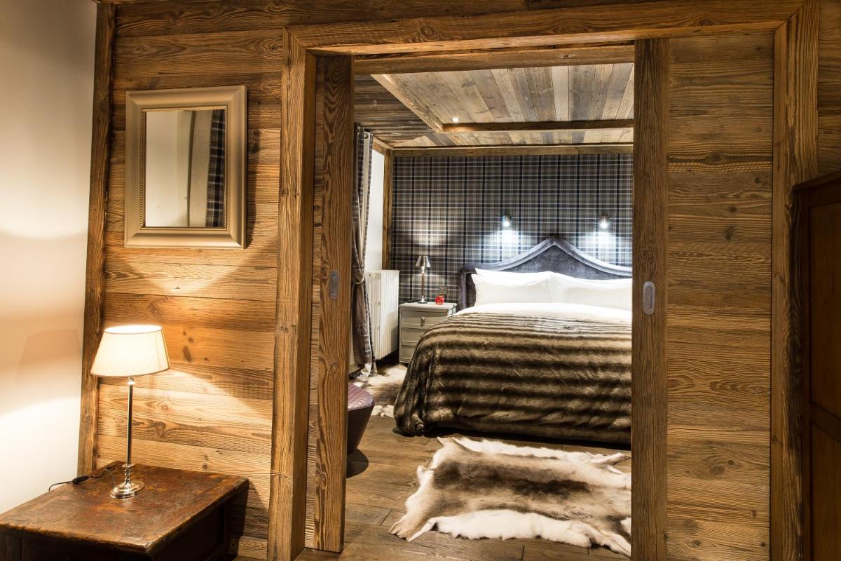 Un ou plusieurs lits dans un hébergement de l'établissement Le Chalet Blanc