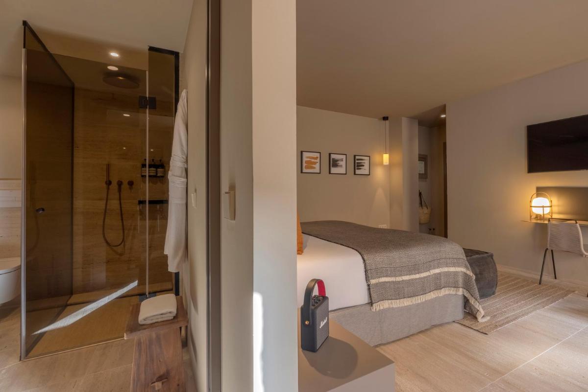 Cama o camas de una habitación en Can Aulí Luxury Retreat - Adults Only