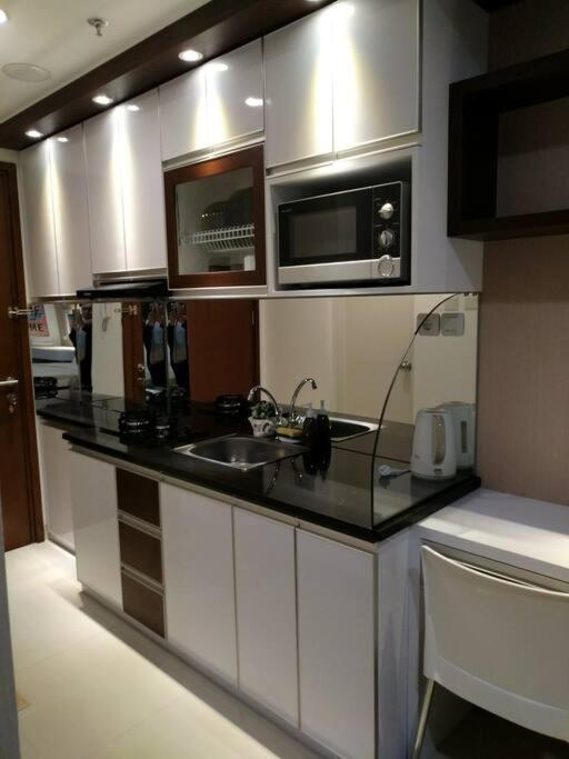 Signature Park Grande The Green Tower - Housity