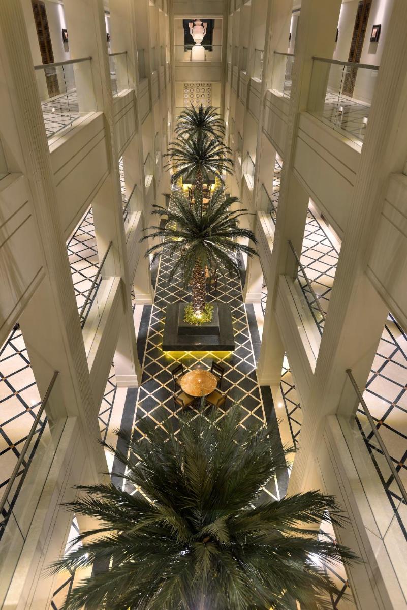 an overhead view of a building with two palm trees at The Lalit Great Eastern Kolkata in Kolkata an overhead view of a building with two palm trees at The Lalit Great Eastern Kolkata in Kolkata