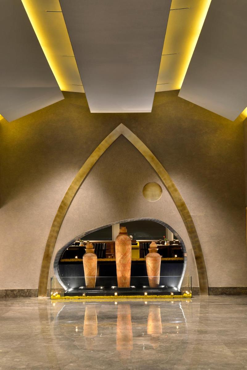 a room with two vases on display in a museum at The Lalit Great Eastern Kolkata in Kolkata a room with two vases on display in a museum at The Lalit Great Eastern Kolkata in Kolkata