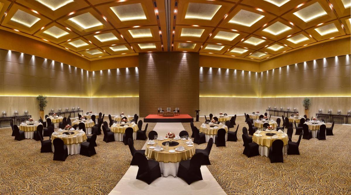 a large banquet hall with tables and chairs at The Lalit Great Eastern Kolkata in Kolkata +77 photos a large banquet hall with tables and chairs at The Lalit Great Eastern Kolkata in Kolkata +77 photos