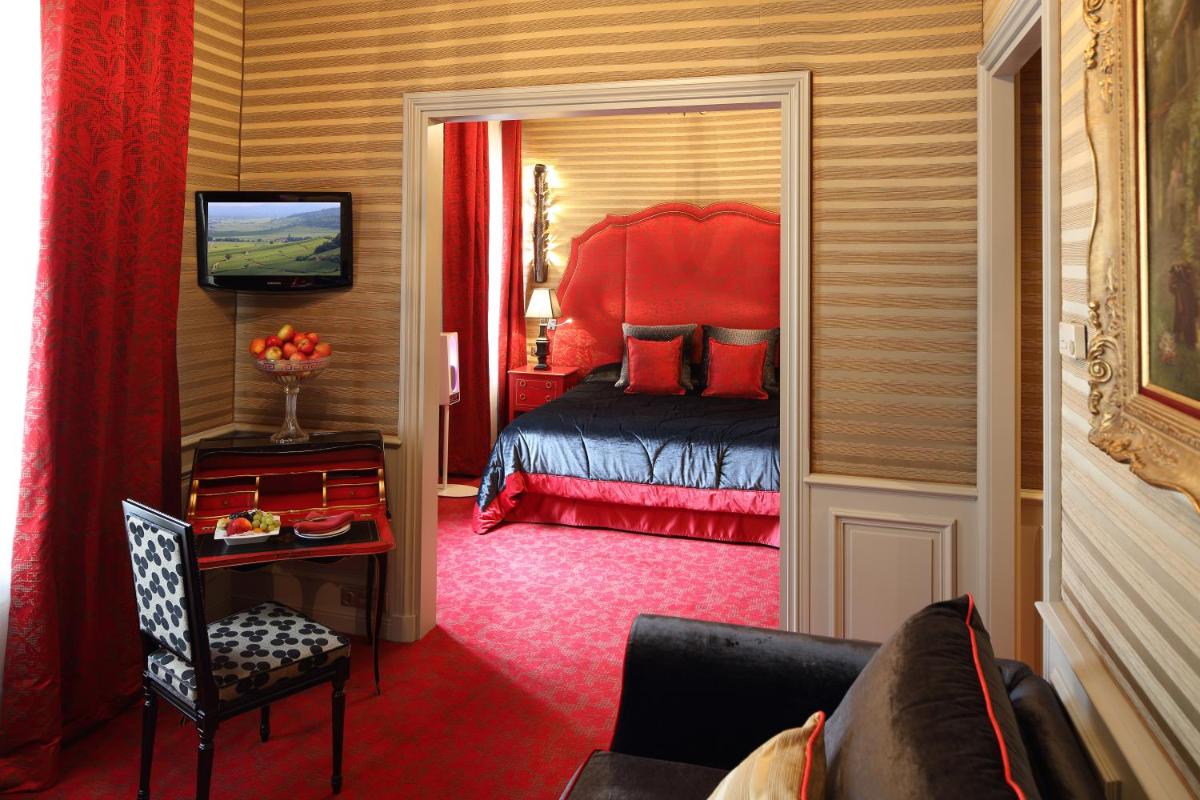 Un ou plusieurs lits dans un hébergement de l'établissement Hôtel Le Cep & Spa