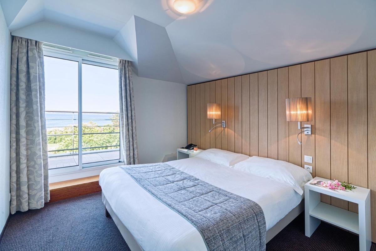 Un ou plusieurs lits dans un hébergement de l'établissement Thalasso Concarneau Spa Marin Resort