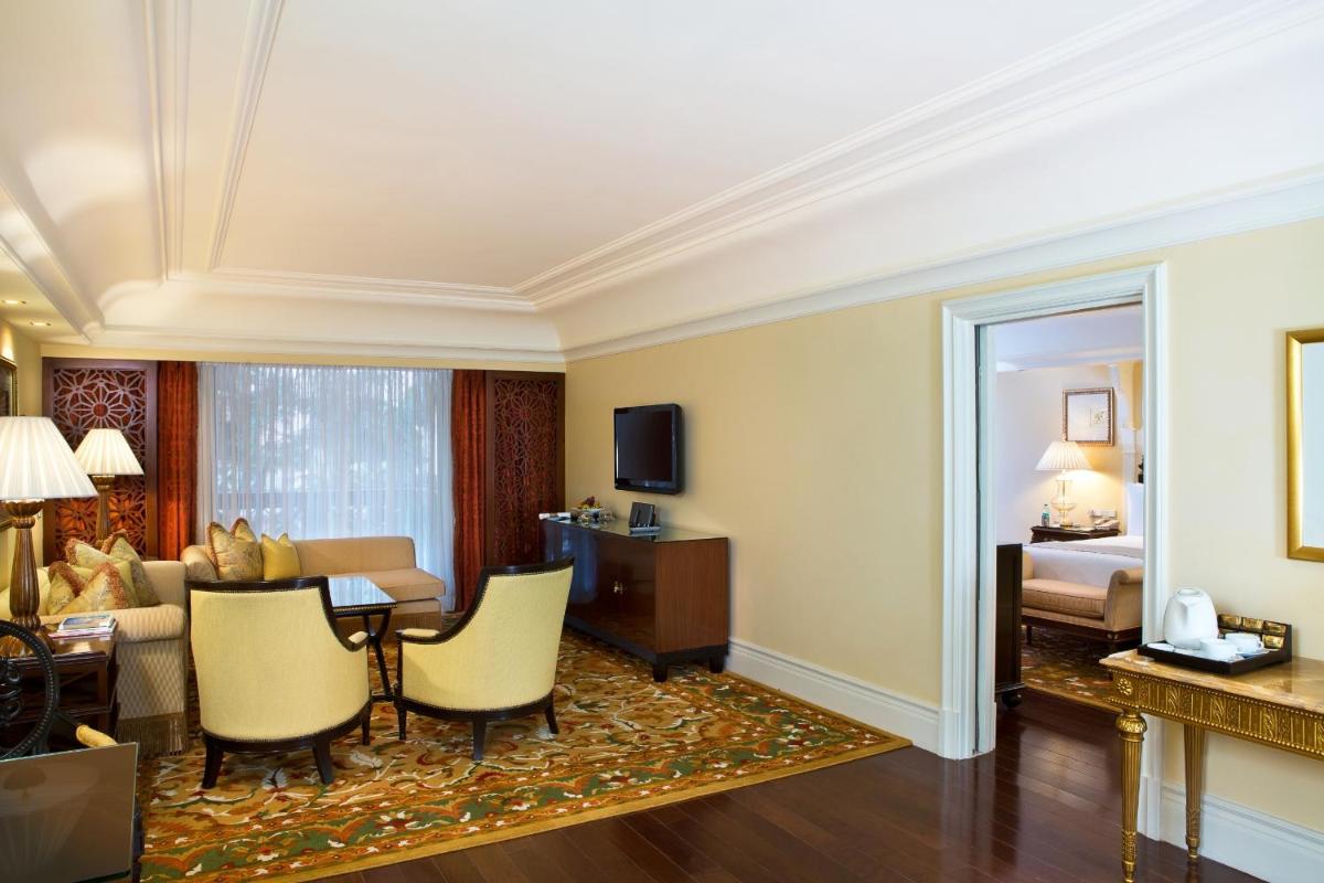 a room with a living room and a bedroom at The Leela Palace Bengaluru in Bengaluru a room with a living room and a bedroom at The Leela Palace Bengaluru in Bengaluru