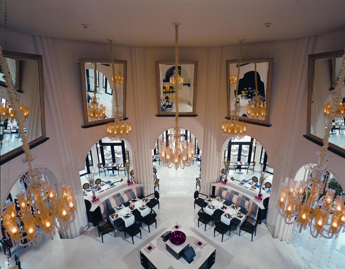 an overhead view of a dining room with tables and chairs at The Leela Palace Bengaluru in Bengaluru +53 photos an overhead view of a dining room with tables and chairs at The Leela Palace Bengaluru in Bengaluru +53 photos