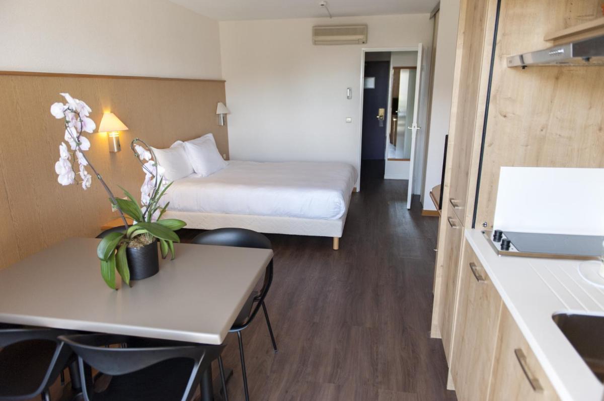 Un ou plusieurs lits dans un hébergement de l'établissement Thalazur Antibes - Résidence & Spa